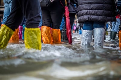An image of boots in rising water