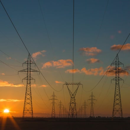 Pylons against an orange sunset