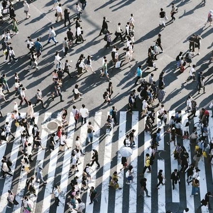 Many people crossing the road